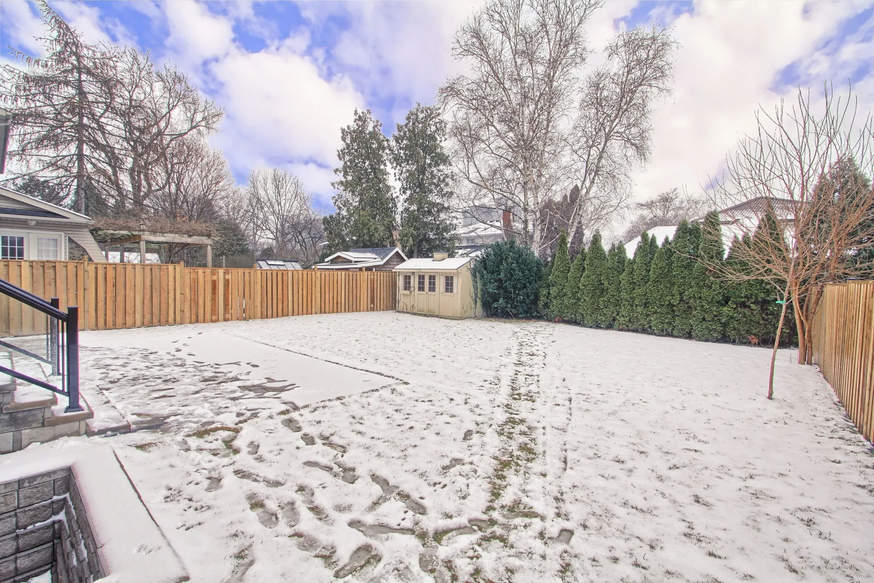Rear yard behind a detached home, the space a detached additional residential unit would occupy